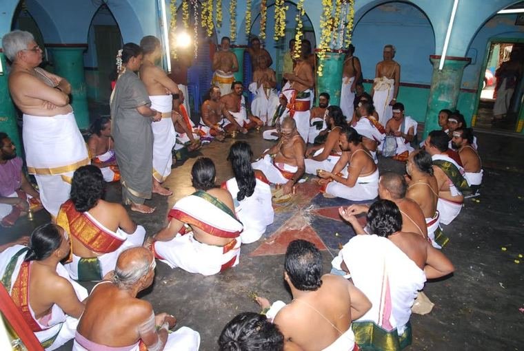 The pooja, in the circle of devotees