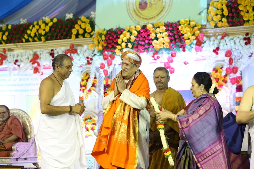 A laureate offers namaskaram on receiving the honour