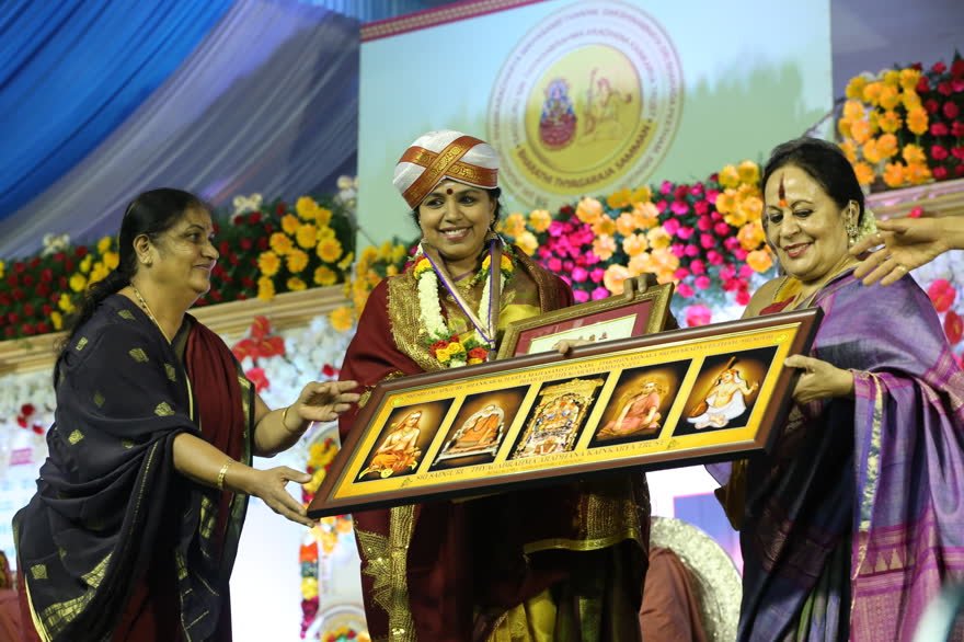 A laureate receives the citation and medallion