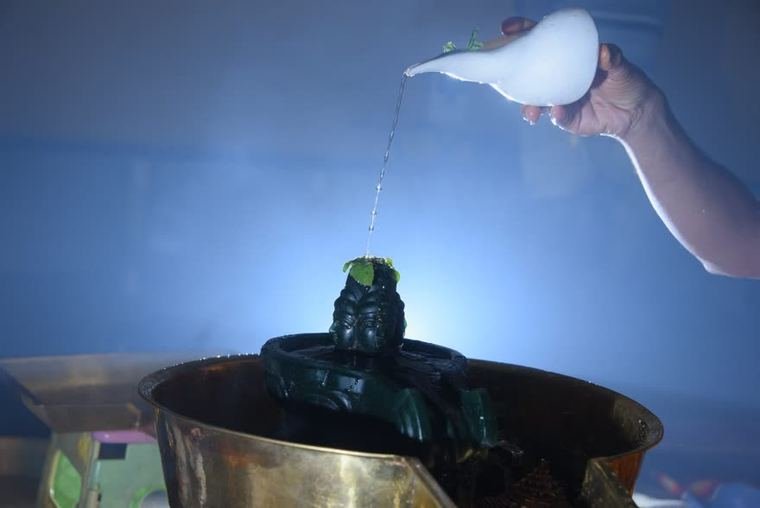 Milk poured over the linga during the Rudraikadashini