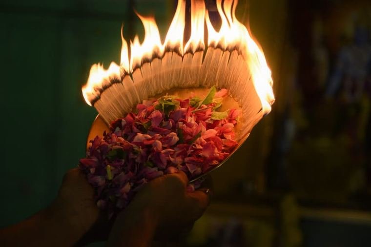 Flame and flowers carried to the shrine